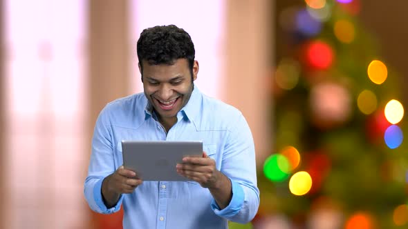 Happy Surprised Man Having Video Chat with Tablet Pc