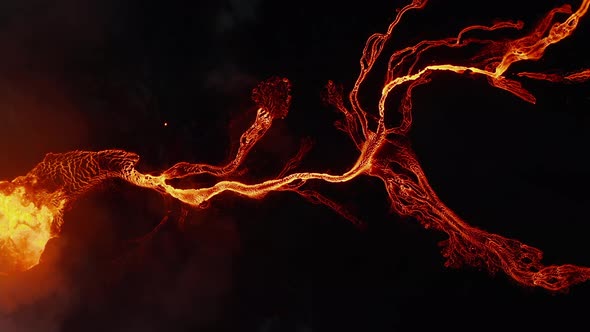 Aerial Birds Eye Overhead Top Down Panning View of Flowing Hot Lava Stream After Volcano Eruption
