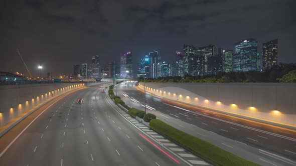 Traffic view with background Singapore landmark financial business district with skyscraper,