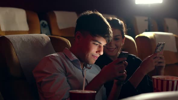 Man and Woman are Playing Game on Mobile Phone