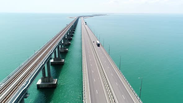 Aerial View of a Bridge Over the Sea with Calm Water