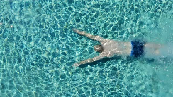 Pool With Blue Water. Water Surface Texture. Top View. Aerial View On Background Of Clean Swimming