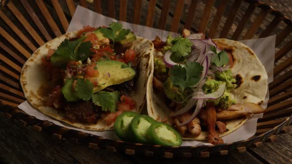 Rotating shot of delicious tacos on a wooden surface - BBQ 151