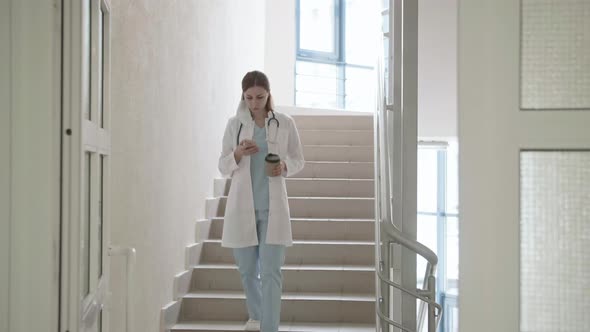 The Masked Doctor Walks the Stairs of the Hospital