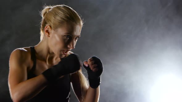 Strong Blows By Hands with Fists of Boxer Sporswoman