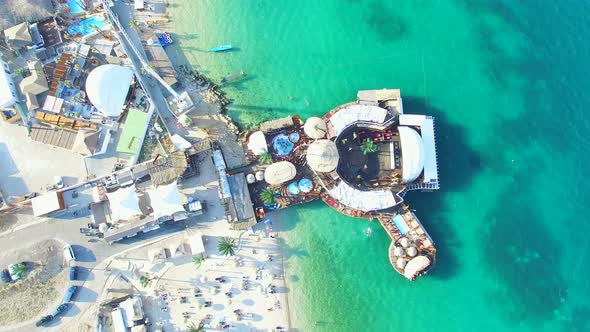 Flying above young people clubbing on zrce beach, Pag island