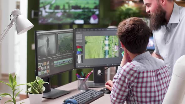 Handheld Shot of Professional Video Editor at Her Workstation