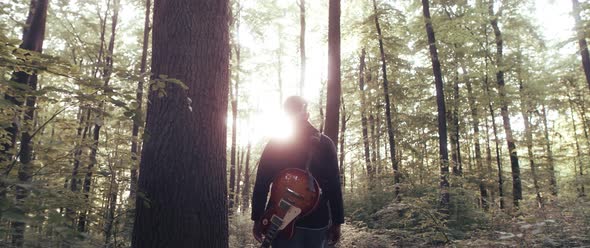 Guitar Player in the Woods