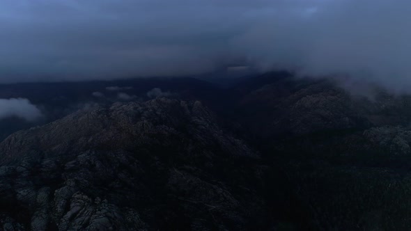 Fly Through the Clouds Over the Mountain Peaks