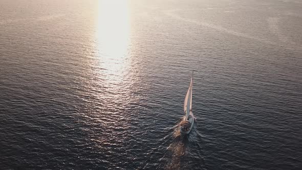 Aerial View on White Sailboat with Flag of Ukraine on It. Floating Across Mediterranean Sea. Lipari