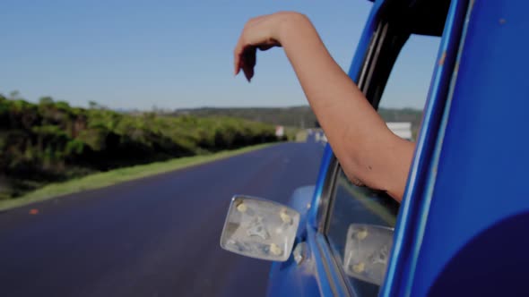 Young woman on a road trip in pick-up truck