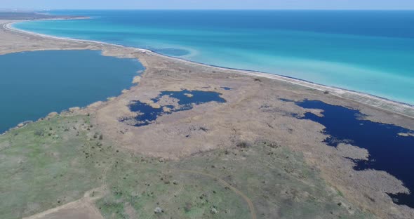 The Wild Bulgaria. 4K aerial view of Durankulak Lake and Black sea coast. Northeastern Bulgaria