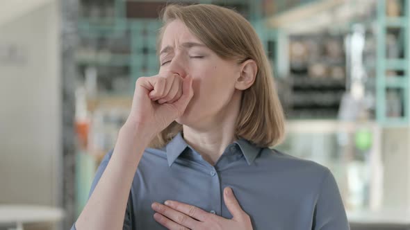 Portrait of Sick Young Woman Coughing