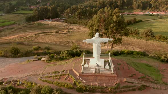 4K daytime before sunset aerial down view over the statue of Cristo Blanco located on the northern h