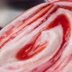Yogurt with berry jam in spoon, blueberry whipped cream, extreme close up - VideoHive Item for Sale