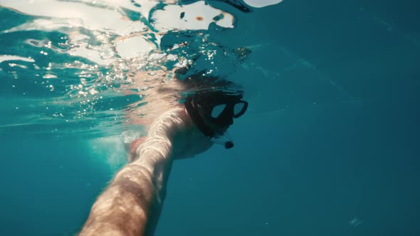 Man Doing a Video Selfie During Swim in the Ocean