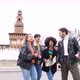 Four multiethnic people friends tourist traveller using map outdoors - VideoHive Item for Sale