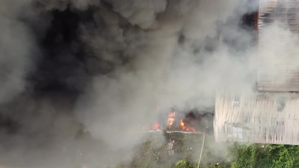 Aerial view black smoke release during fire burning