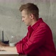 Cheerful American Hipster Working Remotely From Home on Netbook Laptop Smiling Male Freelancer - VideoHive Item for Sale