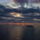 Beautiful sunset with clouds and ships aerial drone shot over the ocean in 4k - VideoHive Item for Sale