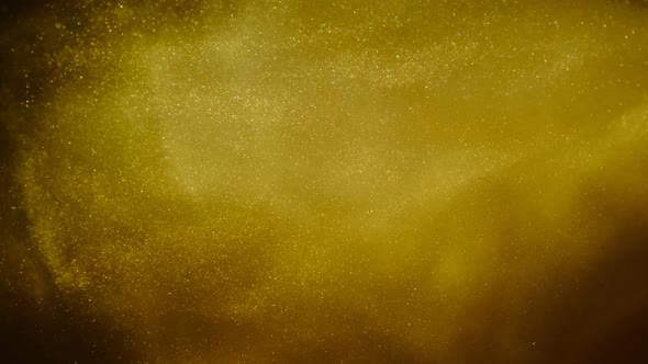 Golden Sand or Dust Creating Abstract Cloud Formations. Art Backgrounds