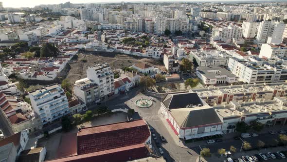Aerial top down view Portimão residential buildings and street roads from Above - Algarve