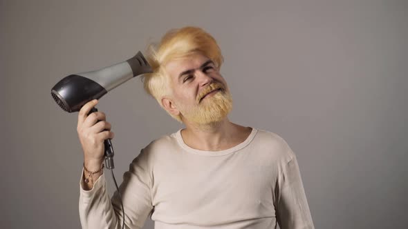 Man with Dyed Hair Moustache and Beard. Male Colored Hairstyle, Blonde Guy in Beauty Salon