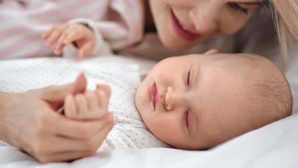 Joyful Young Mother Hugging Sleepy Little Kid Talking Lovely Words