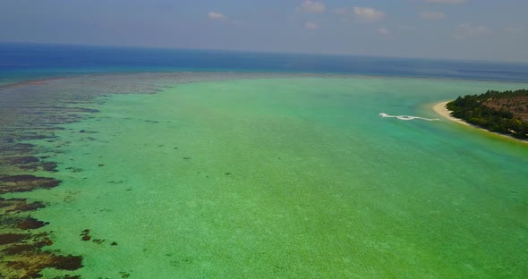 Luxury drone island view of a sunshine white sandy paradise beach and turquoise sea background in be