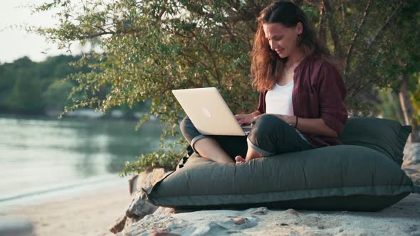 Young Caucasian Woman Freelancer Using Her Laptop