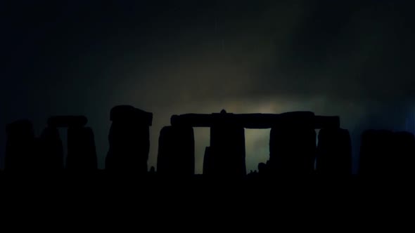 Stonehenge Silhouette At Night Under A Lightning Storm And Rain