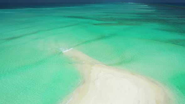 Aerial above sky of perfect lagoon beach vacation by blue sea with clean sand background of a dayout