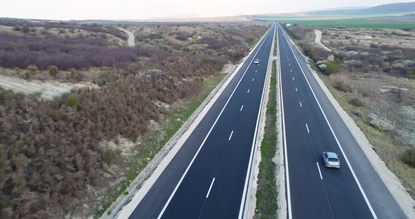 4K Aerial shot of Highway. Cars and trucks running on the highway