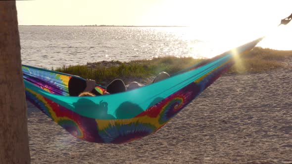 Girlfriends Watching Sunset in Hammock