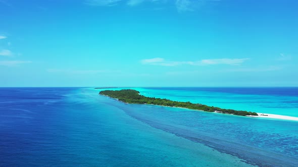 Daytime drone abstract view of a sunshine white sandy paradise beach and blue sea background in high res