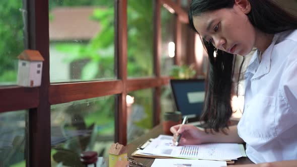 young business people working and approving document in cafes co-working space using computer laptop