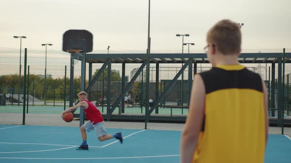 Young man playing basketball on the court