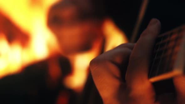 The musician plays the acoustic guitar