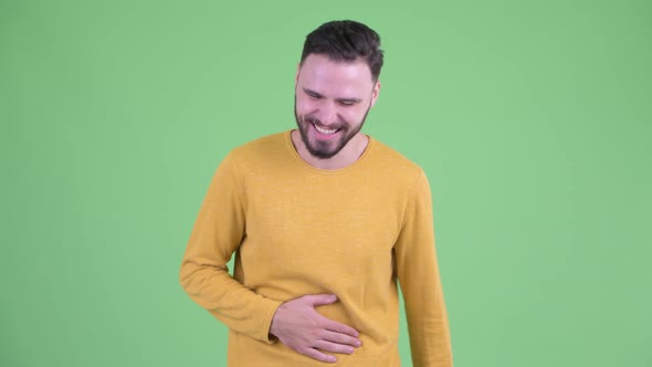 Happy Young Handsome Bearded Man Laughing