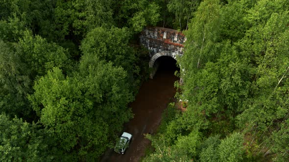 Aerial View of the Car Entering the Tunnel