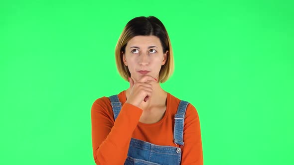 Young Girl Thinks About Something, and Then an Idea Comes To Her. Green Screen
