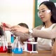 Asian School Teacher and Students in Science Class - VideoHive Item for Sale