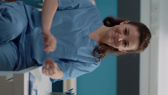 Vertical Video Portrait of Woman Working As Medical Assistant at Desk