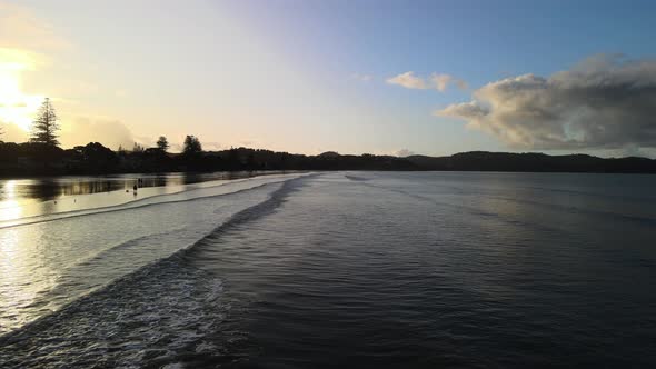 Sunset along a beautiful stretch of sand in New Zealand