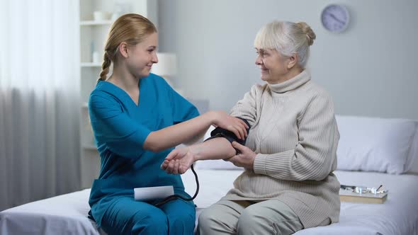 Cardiologist Measuring Old Female Patient Blood Pressure, Professional Medicare