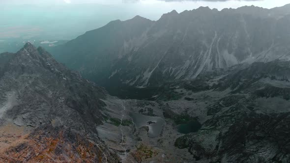 AERIAL Mountain range view with multiple lakes and epic landscape