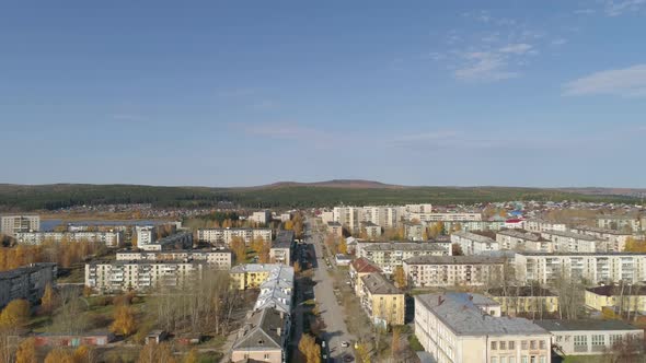 Aerial view of A small provincial Russian city with five-story buildings. Autumn sunny day. 48
