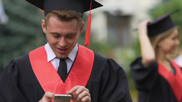 Young Man Reading Sms, Successful Graduating Student Got Good Career Opportunity
