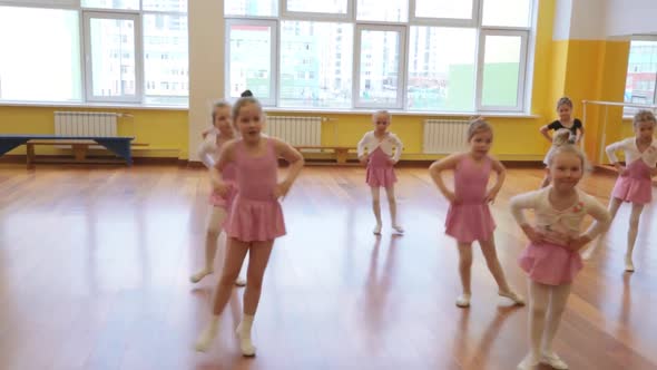 Group of little girls practicing in ballet school