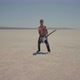Redhead Barefoot Bloody Musician Plays On Guitar With Chains Around His Neck In Desert - VideoHive Item for Sale